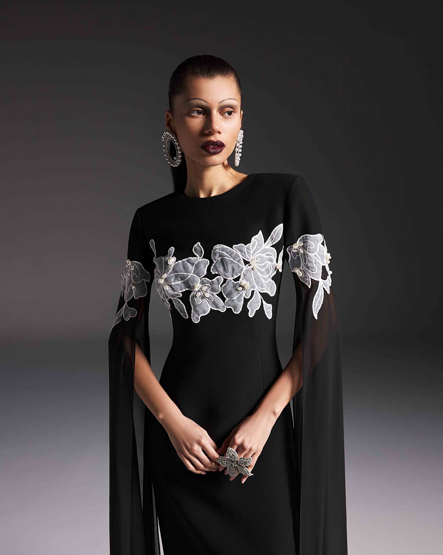 AFFFAIR - Modest black dress with floral embroidery, pearls and cape sleeves AFFFAIR - Modest black dress with floral embroidery, pearls and cape sleeves